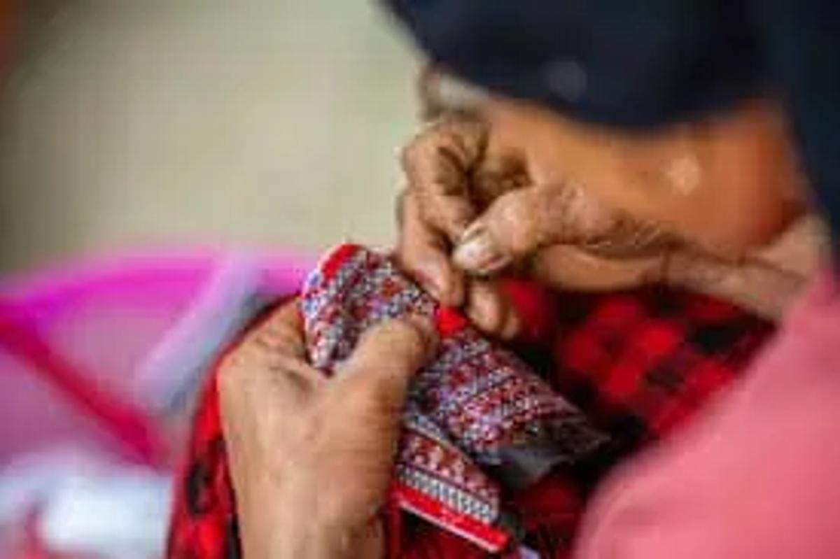 woman stitching clothes
