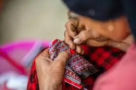 woman stitching clothes