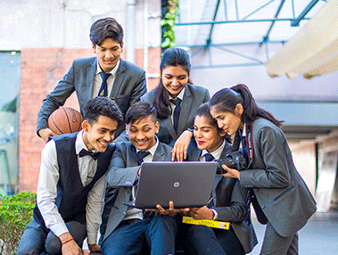 Inspiria students working together on a laptop