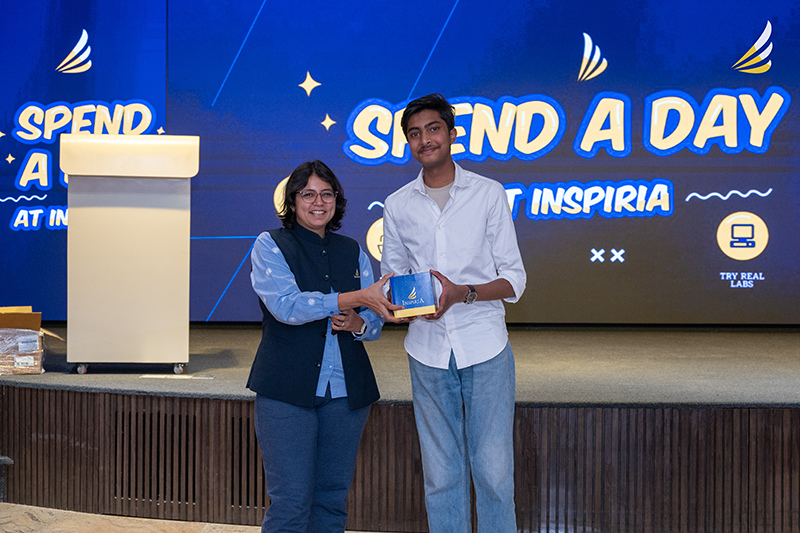 A student felicitated on stage at Spend a Day @ Inspiria