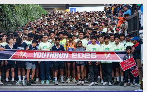 Runners at the YouthRun finish on campus