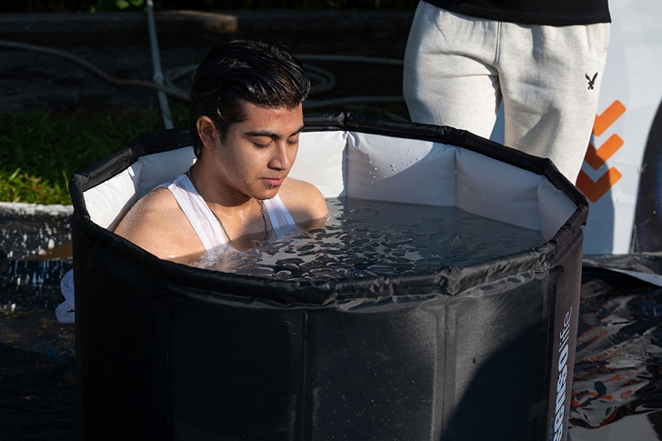 A YouthRun participant in an ice bath during recovery